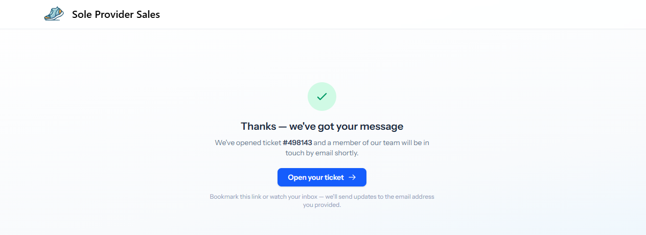 The success state showing a green tick, the ticket number, and a button labelled Open your ticket