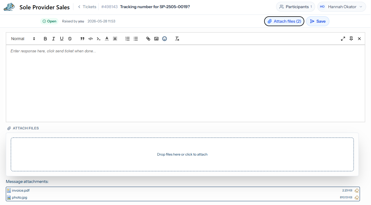 The reply editor open on ticket #498143 with the Attach files button in the top-right showing a count of two, the dashed dropzone revealed below the editor, and a Message attachments list underneath listing invoice.pdf at 2.23 KB and photo.jpg at 810.13 KB